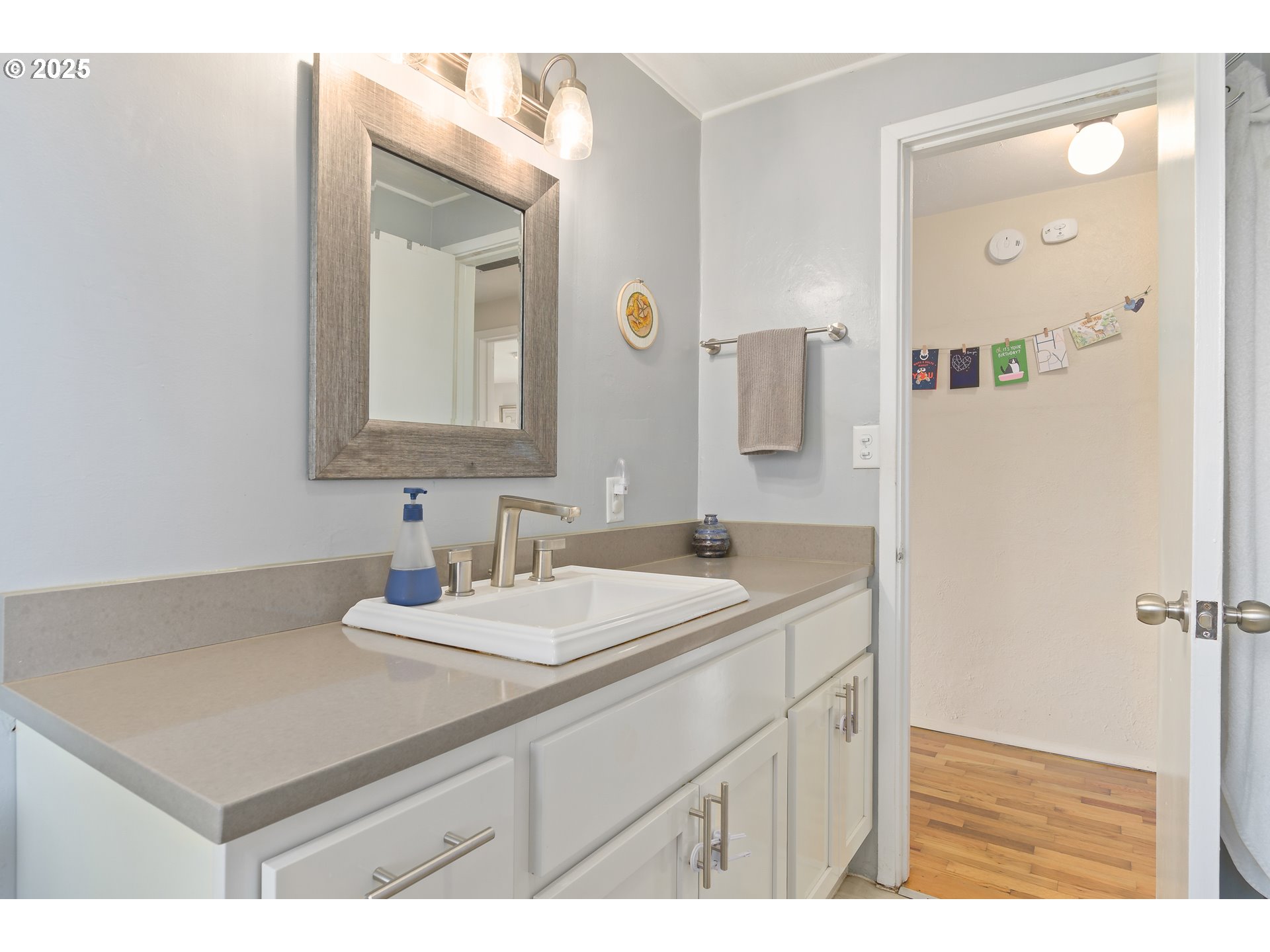 3417 Harlow Road Eugene, OR 97401 - Photo 24 of 40 a bathroom with a sink vanity and a mirror
