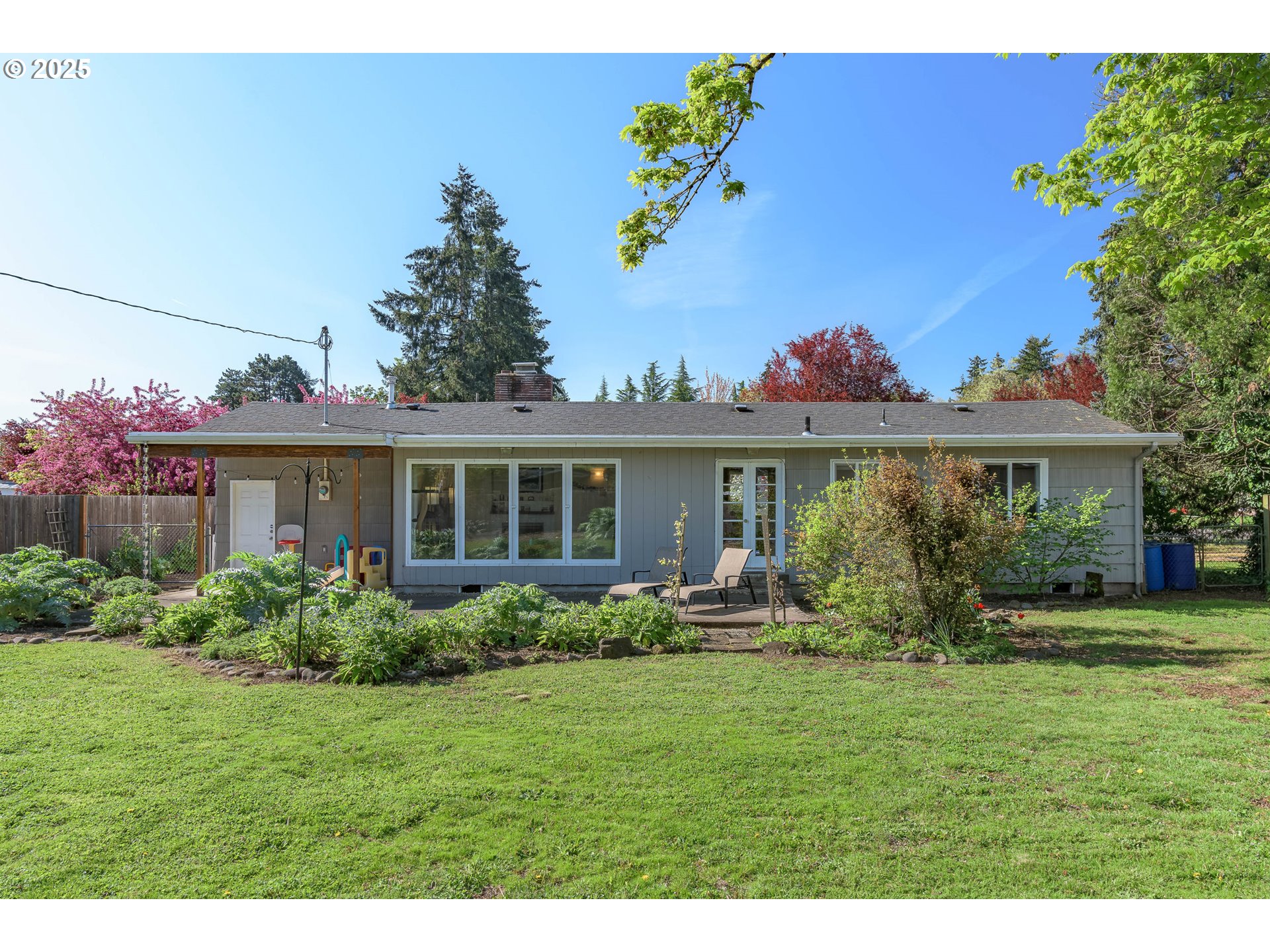 3417 Harlow Road Eugene, OR 97401 - Photo 29 of 40 a front view of house with a yard and potted plants