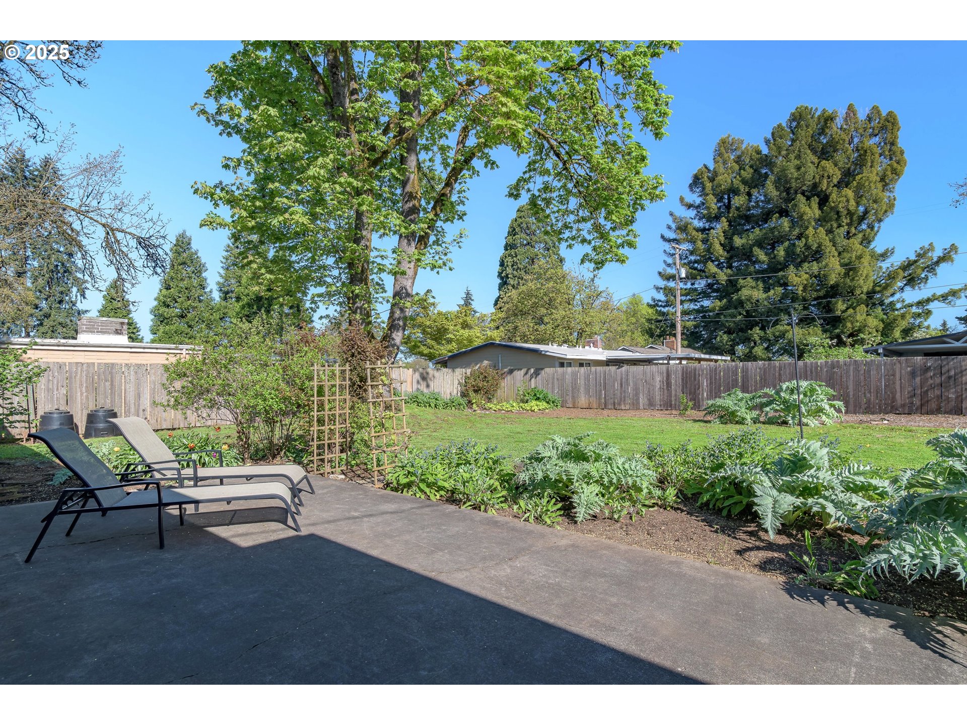 3417 Harlow Road Eugene, OR 97401 - Photo 31 of 40 a backyard of a house with lots of green space