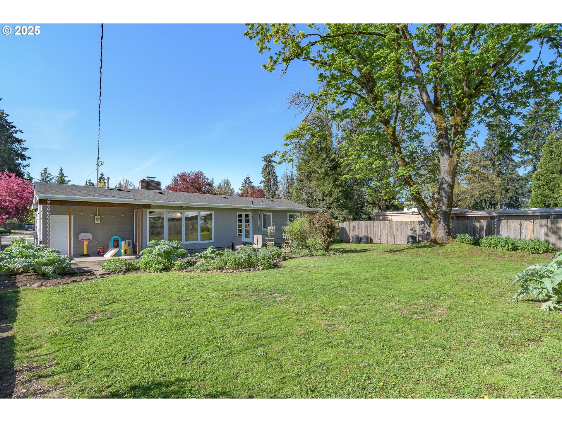 3417 Harlow Road Eugene, OR 97401 - Photo 35 of 40 a view of a house with yard and a garden
