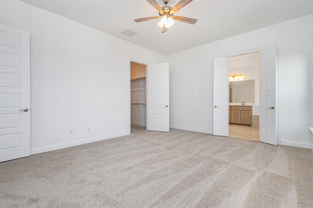 6044 Mango Drive Sanger, TX 76266 - Photo 21 of 27 an empty room with closet and windows