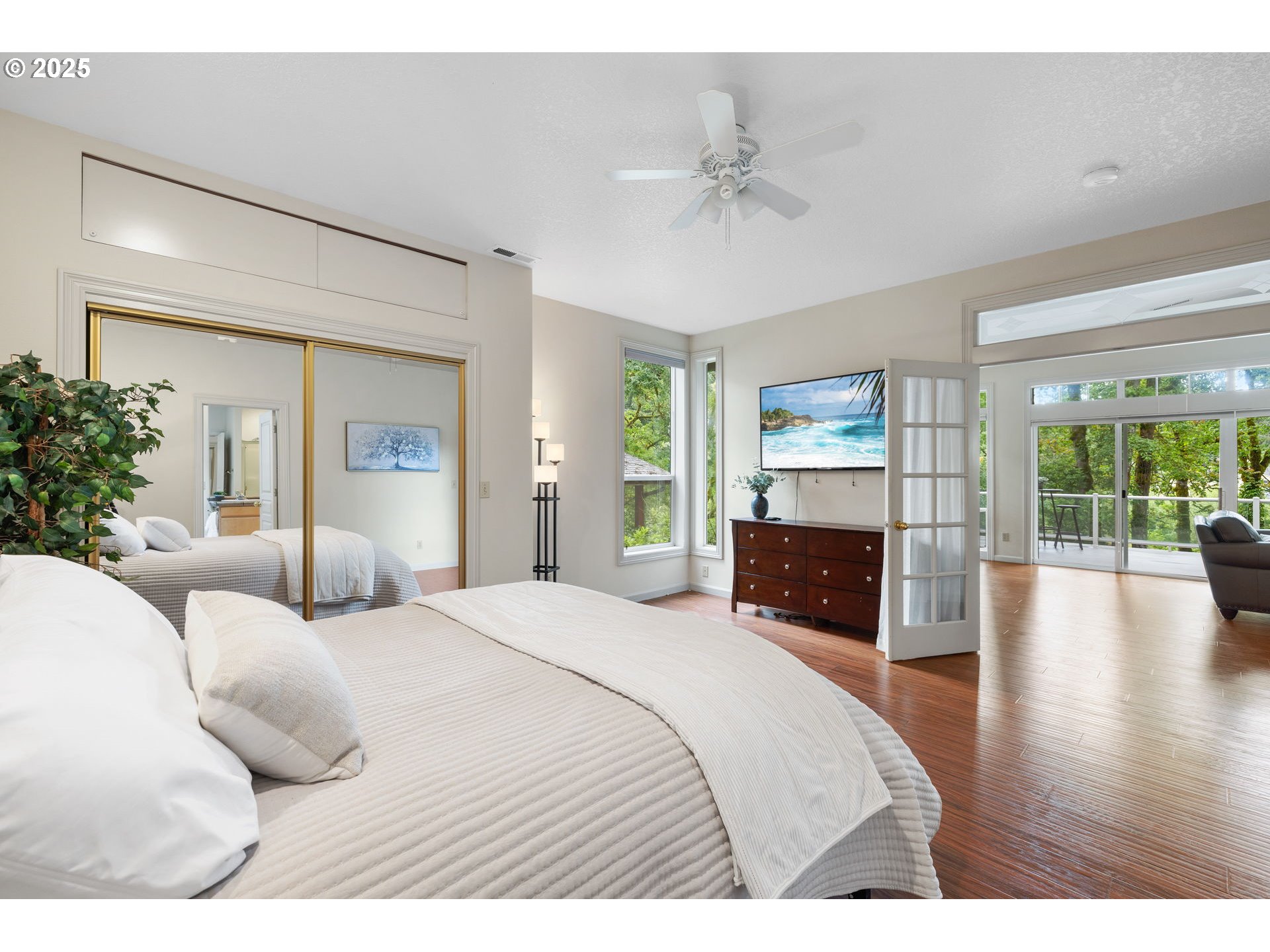 690 North Shepherd Road Washougal, WA 98671 - Photo 23 of 38 a bedroom with a large bed and a wooden floor