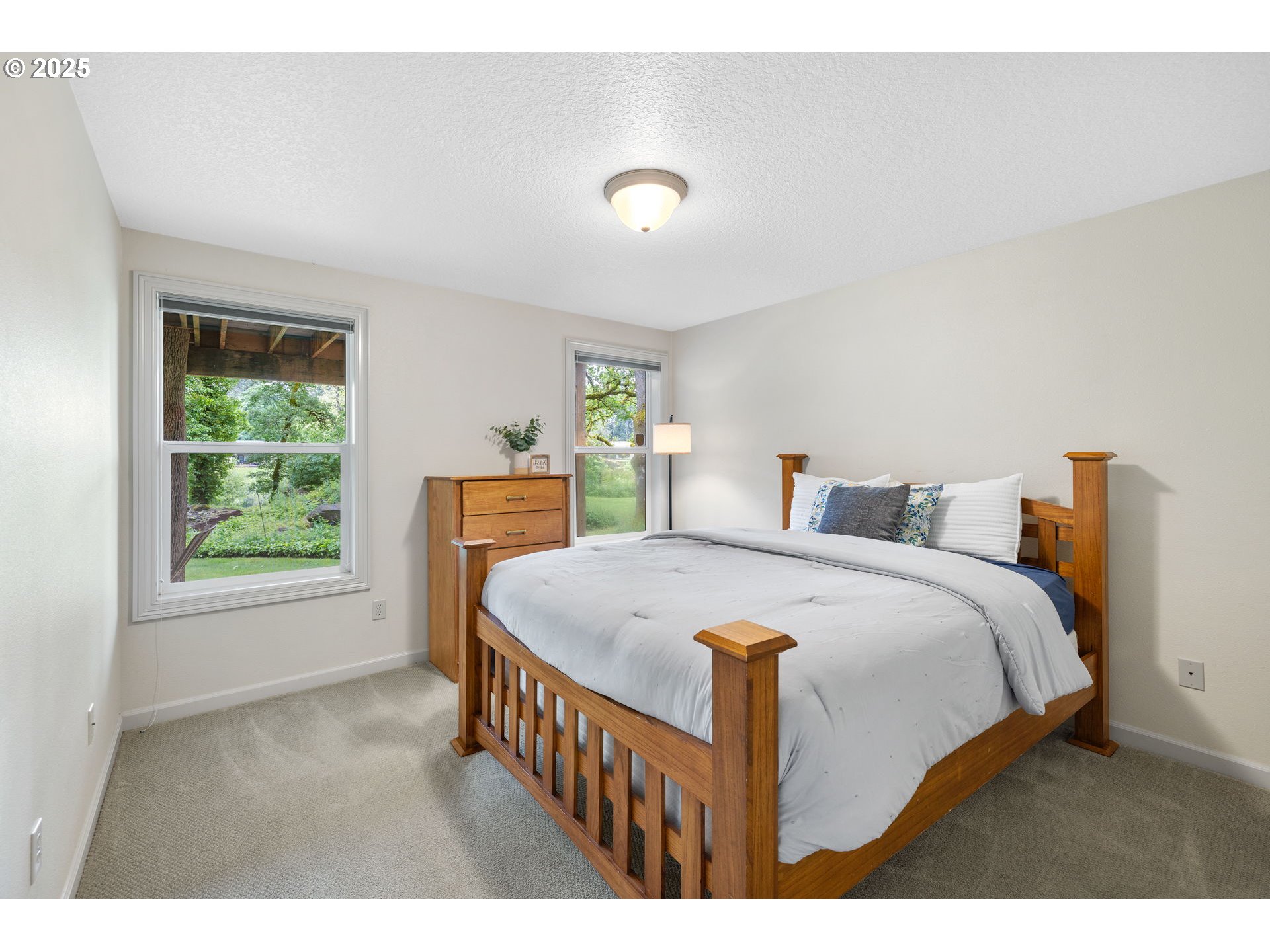 690 North Shepherd Road Washougal, WA 98671 - Photo 32 of 38 a bedroom with a bed a window and potted plant