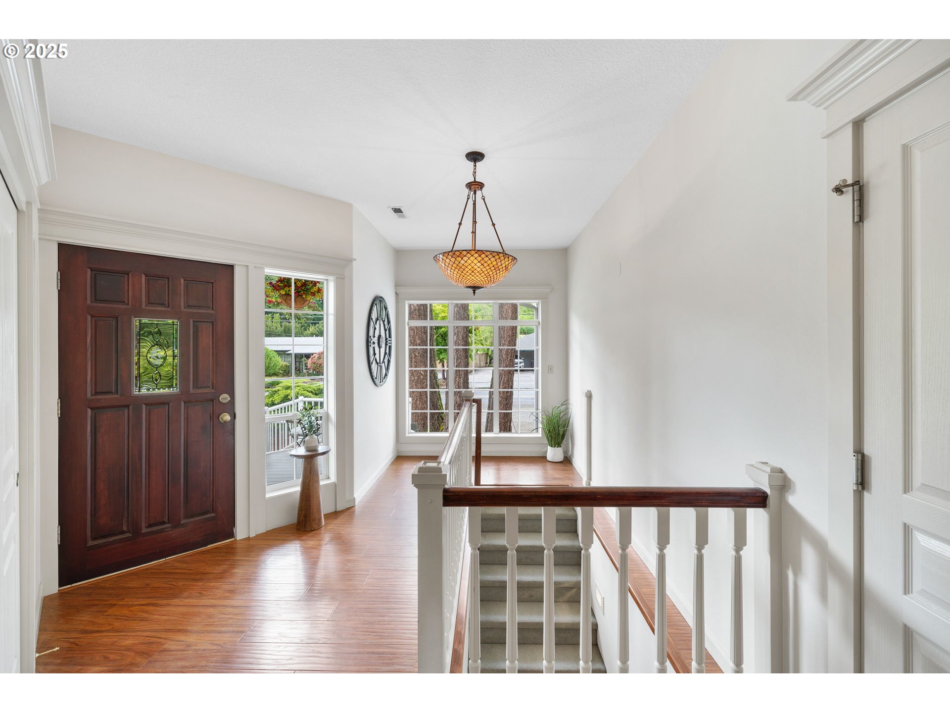 690 North Shepherd Road Washougal, WA 98671 - Photo 7 of 38 a view of a hallway with wooden floor and furniture