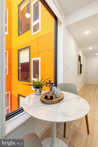 a view of a dining room with furniture and a window