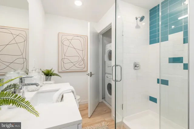 a bathroom with a sink and a shower