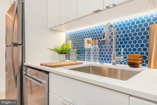 a bathroom with a sink and mirror