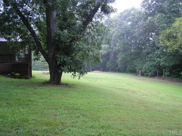 42 George Ray Road Moncure, NC 27559 - Photo 2 of 4 a view of a yard with a tree
