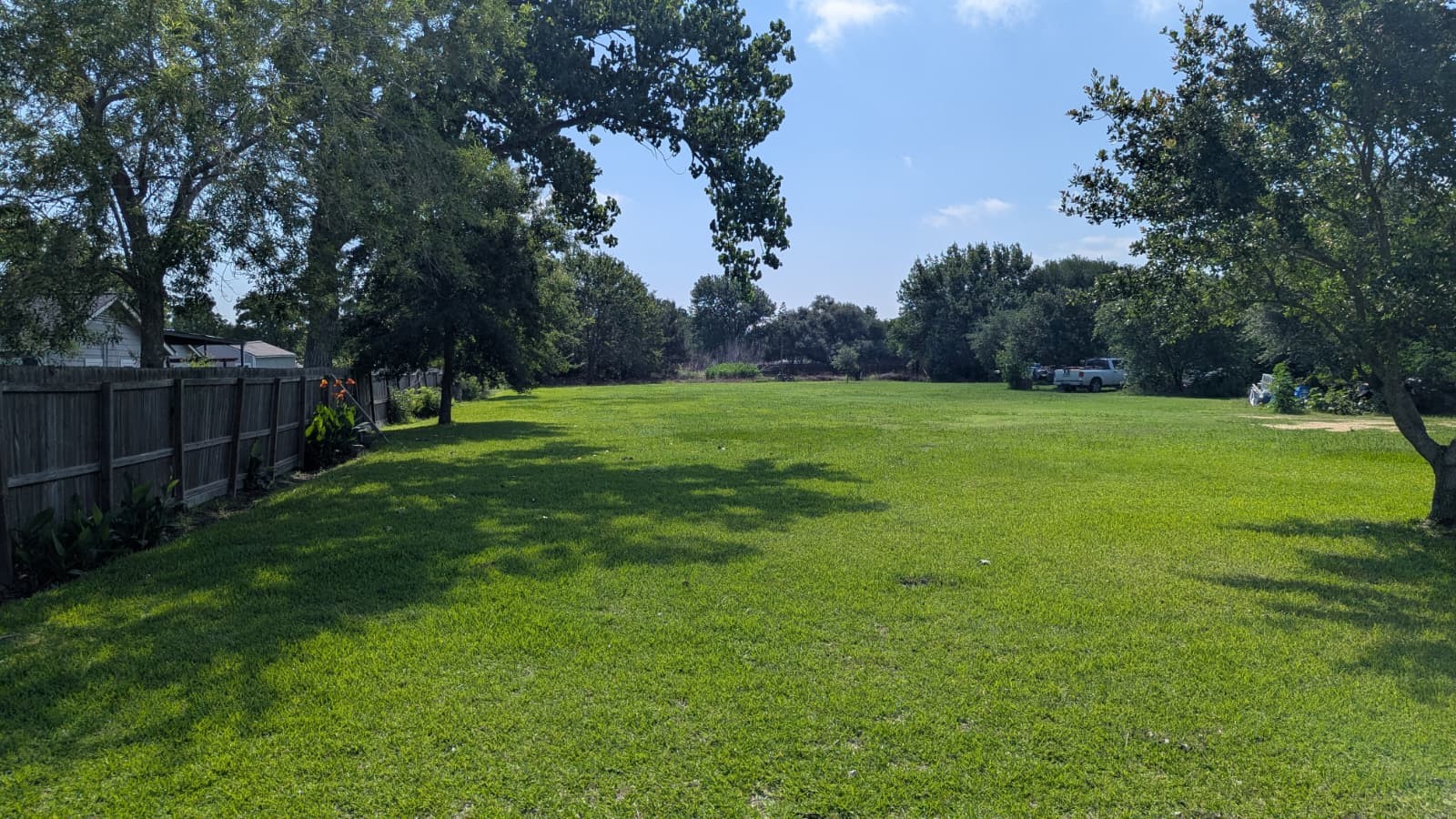 13929 Quention Drive Houston, TX 77045 - Photo 1 of 4 a view of a grassy field with trees