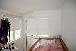 4 Wescott Court Riverside, CT 06878 - Photo 6 of 7 a bed room with a bed and a window