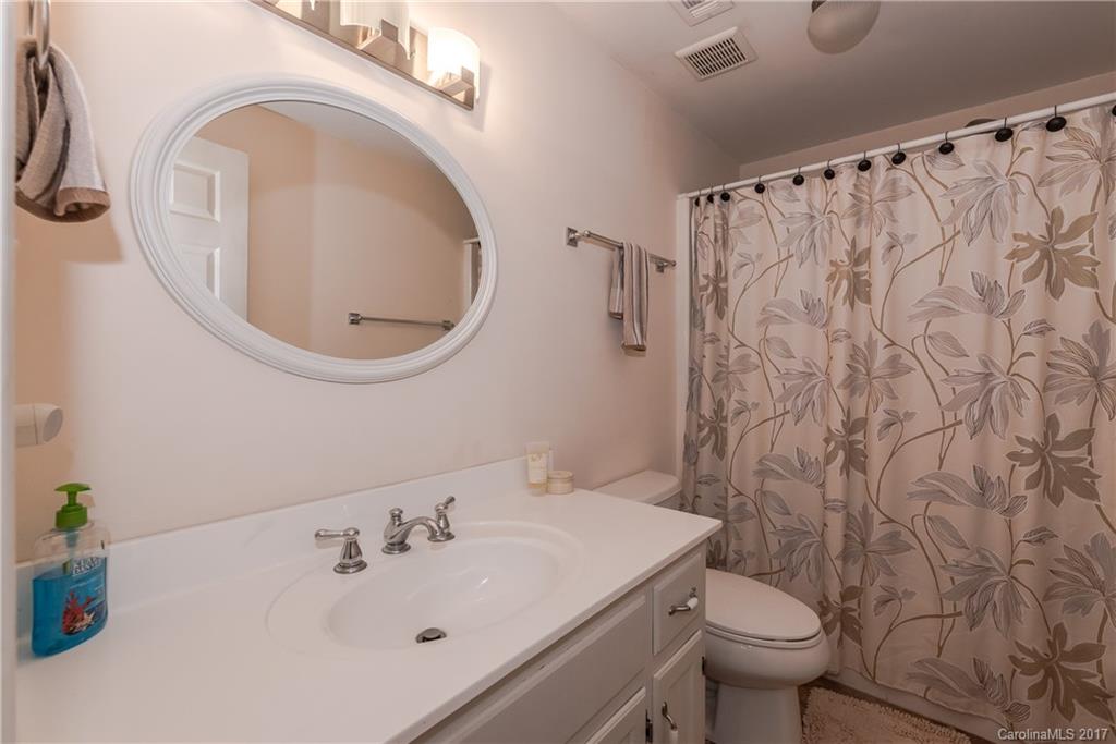 29050 Snapper Point Tega Cay, SC 29708 - Photo 22 of 24 a bathroom with a sink a toilet and a mirror
