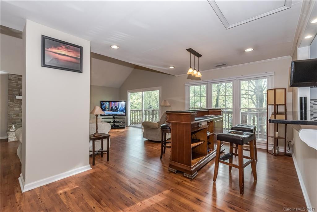 29050 Snapper Point Tega Cay, SC 29708 - Photo 8 of 24 a view of a livingroom with furniture and a flat screen tv