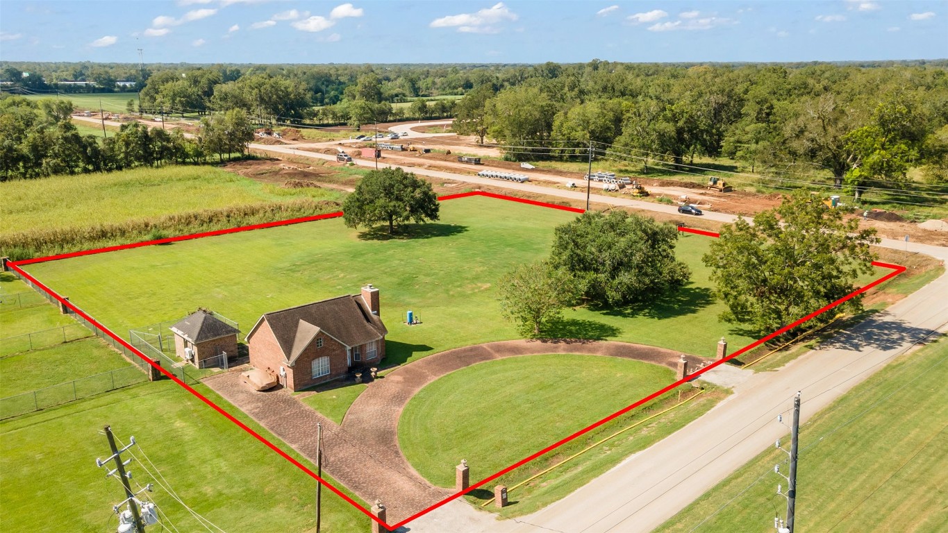 3745 Clayhead Road Richmond, TX 77406 - Photo 2 of 14 Charming 900 sqft home with expansive land, perfect for future development opportunities.