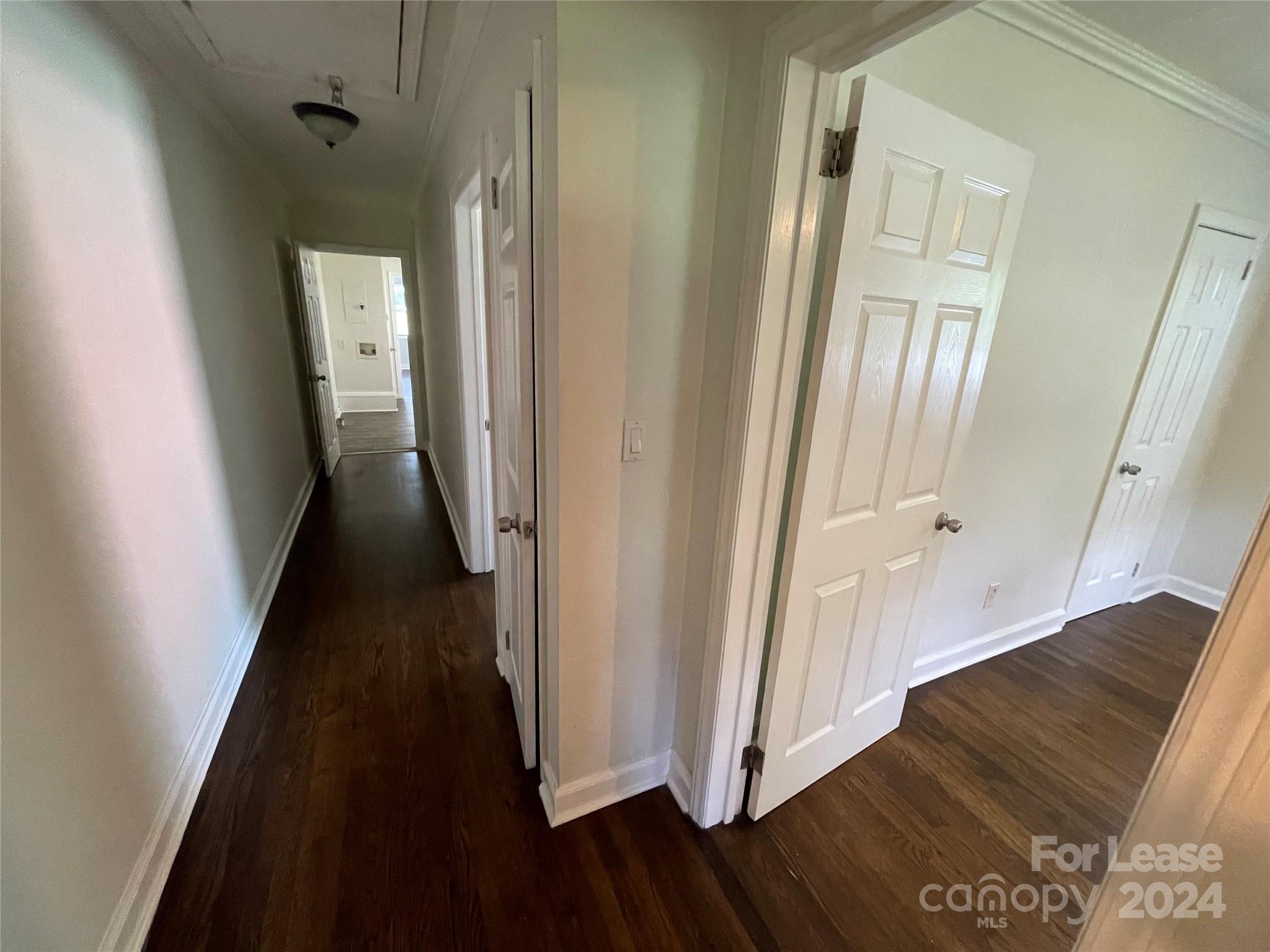 7228 Tuckaseegee Road, Unit A Charlotte, NC 28214 - Photo 3 of 7 a view of a hallway with wooden floor and staircase