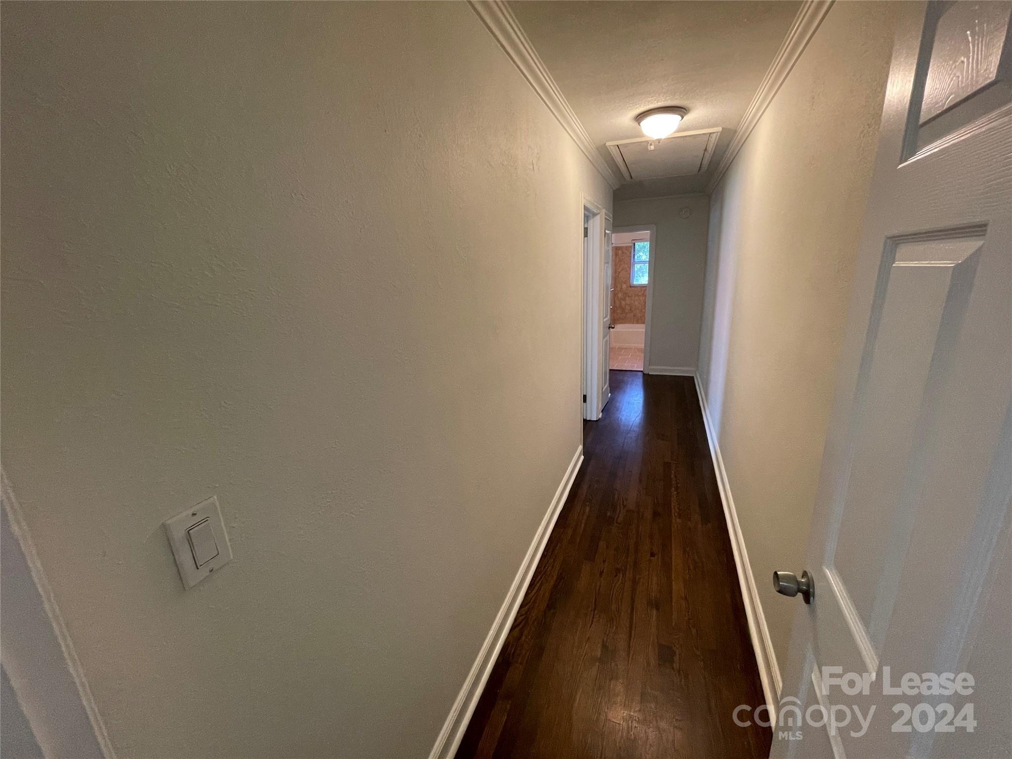 7228 Tuckaseegee Road, Unit A Charlotte, NC 28214 - Photo 6 of 7 a view of a hallway with wooden floor