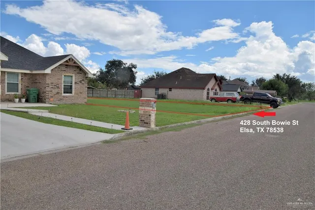 a view of street with residential houses