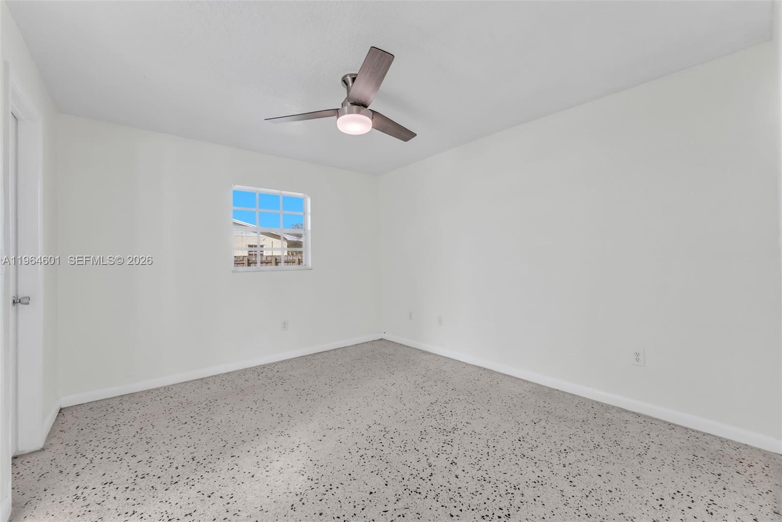 15231 Southwest 302nd Street Homestead, FL 33033 - Photo 11 of 30 an empty room with a window
