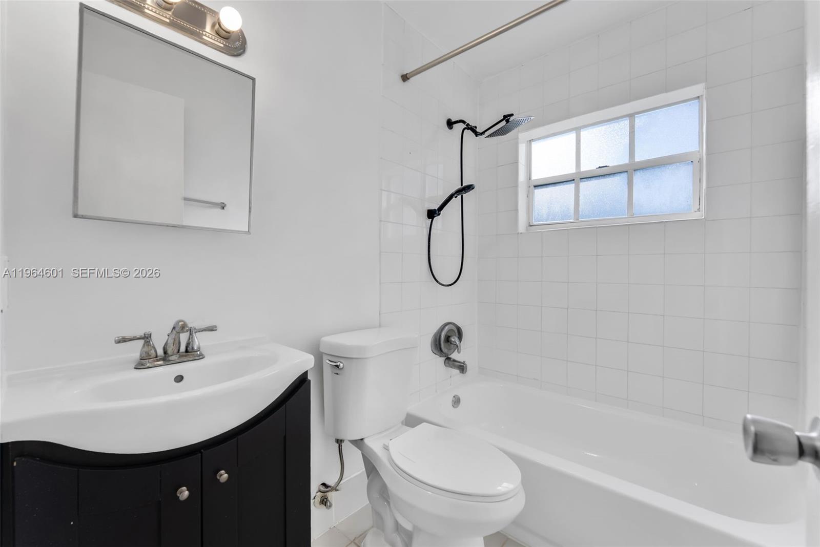 15231 Southwest 302nd Street Homestead, FL 33033 - Photo 13 of 30 a bathroom with a sink a toilet and shower