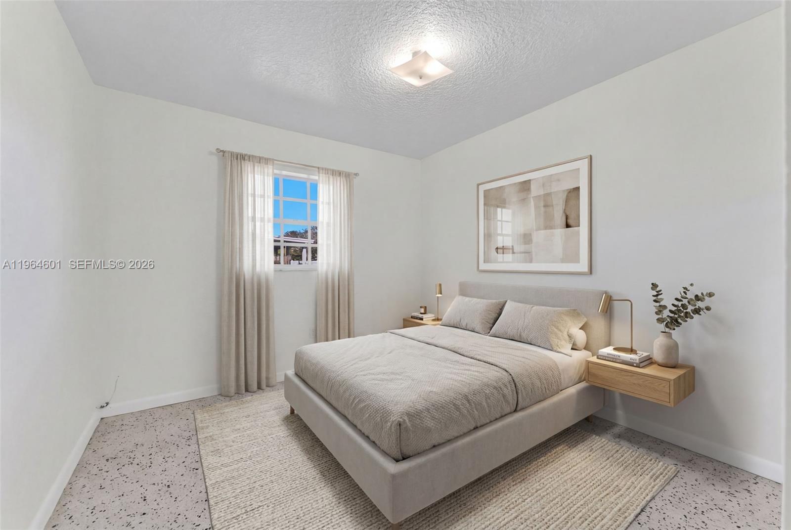 15231 Southwest 302nd Street Homestead, FL 33033 - Photo 14 of 30 a bedroom with a bed and a night stand