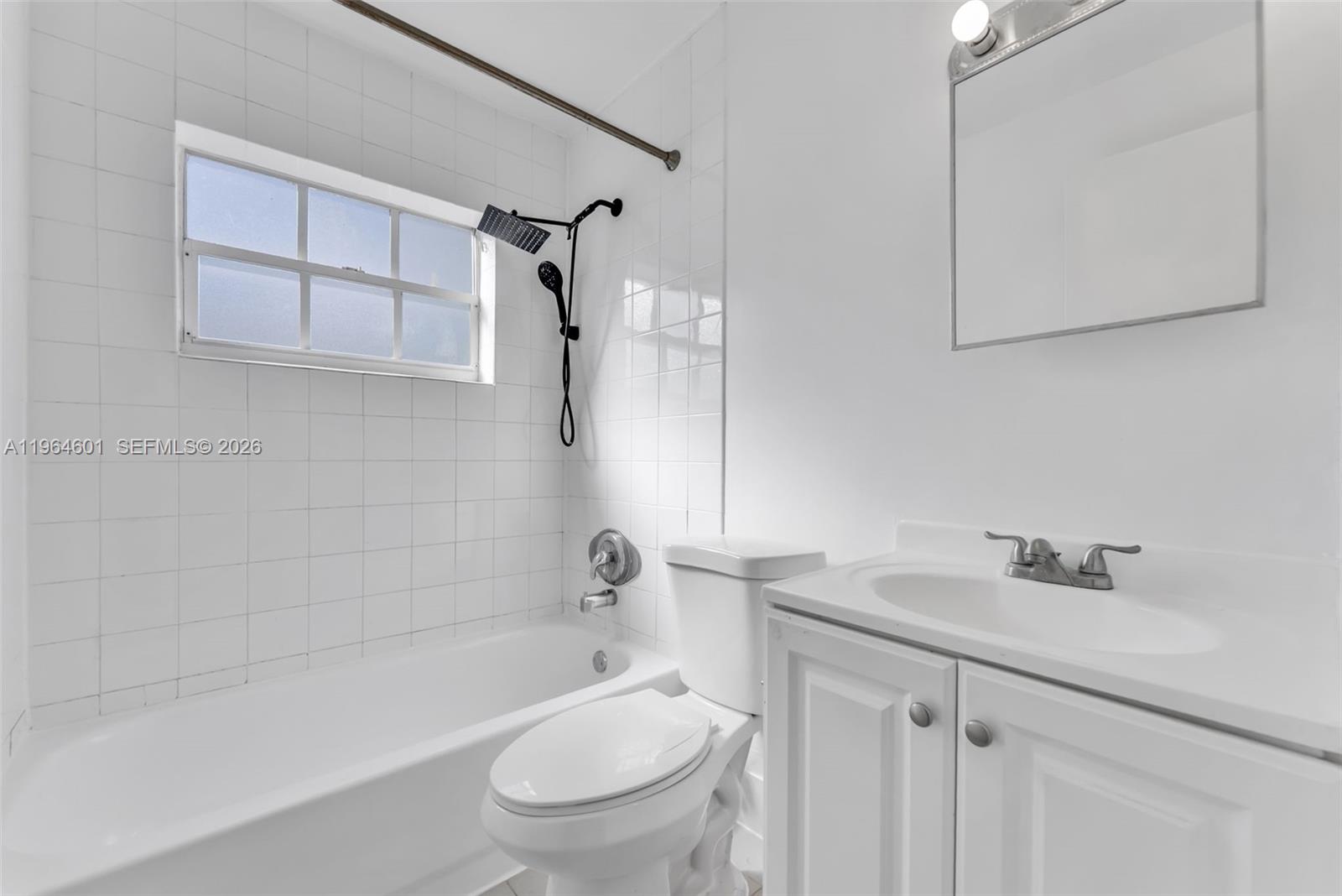 15231 Southwest 302nd Street Homestead, FL 33033 - Photo 17 of 30 a bathroom with a sink toilet and shower