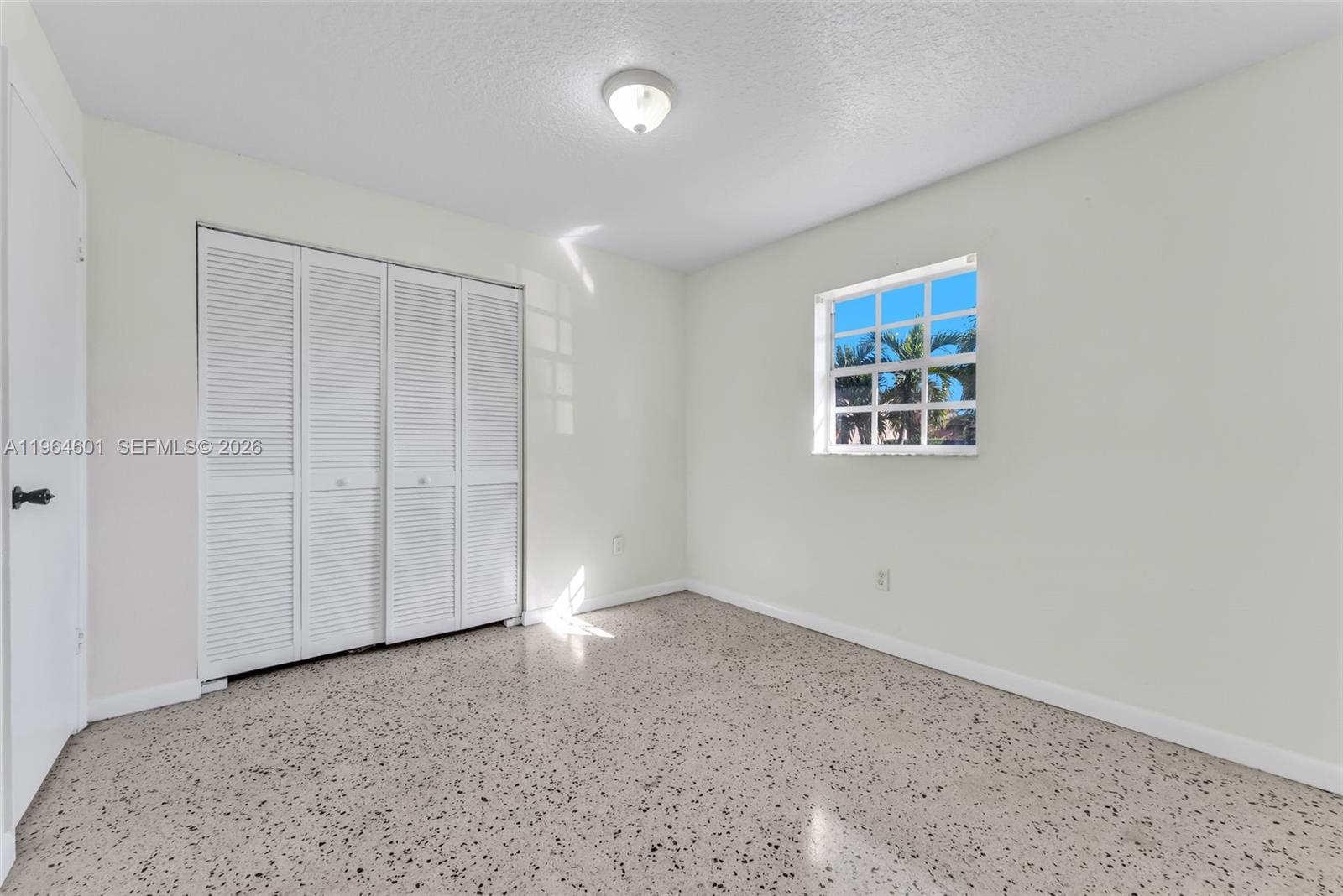 15231 Southwest 302nd Street Homestead, FL 33033 - Photo 19 of 30 an empty room with windows