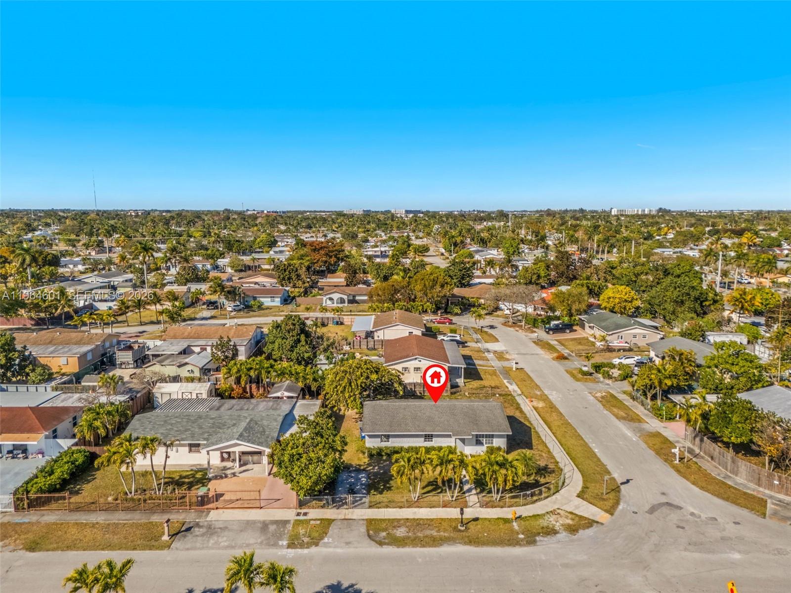 15231 Southwest 302nd Street Homestead, FL 33033 - Photo 2 of 30 an aerial view of residential houses with city view