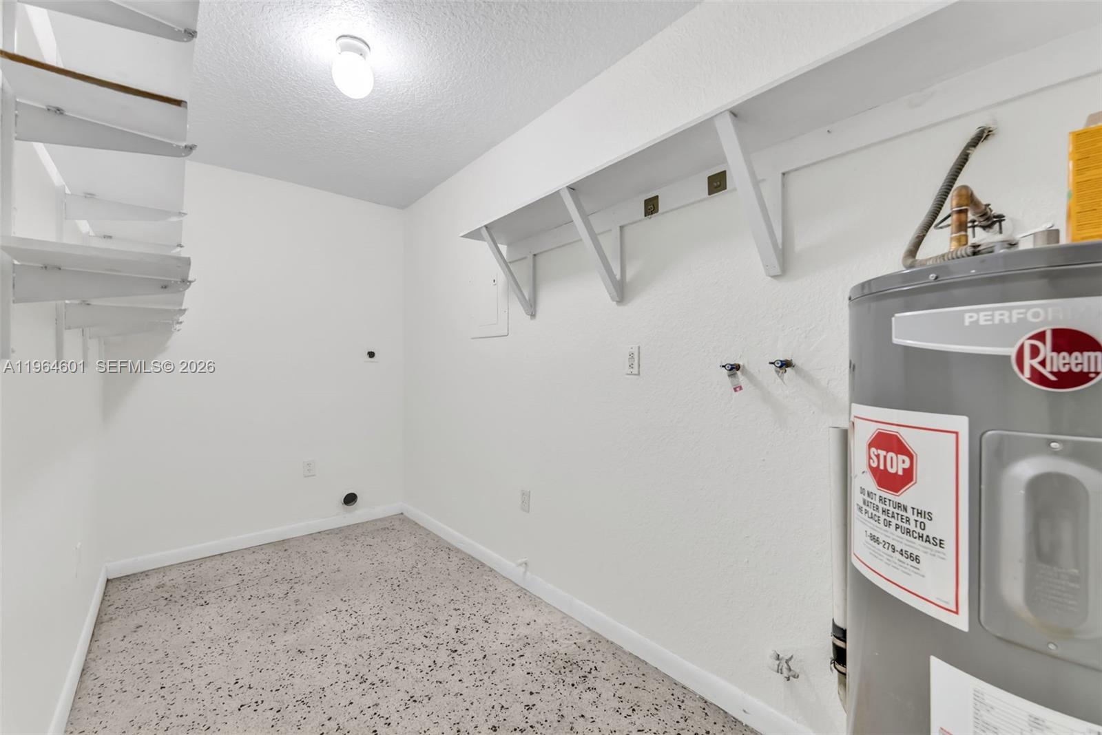 15231 Southwest 302nd Street Homestead, FL 33033 - Photo 23 of 30 a view of a storage & utility room with a washer dryer