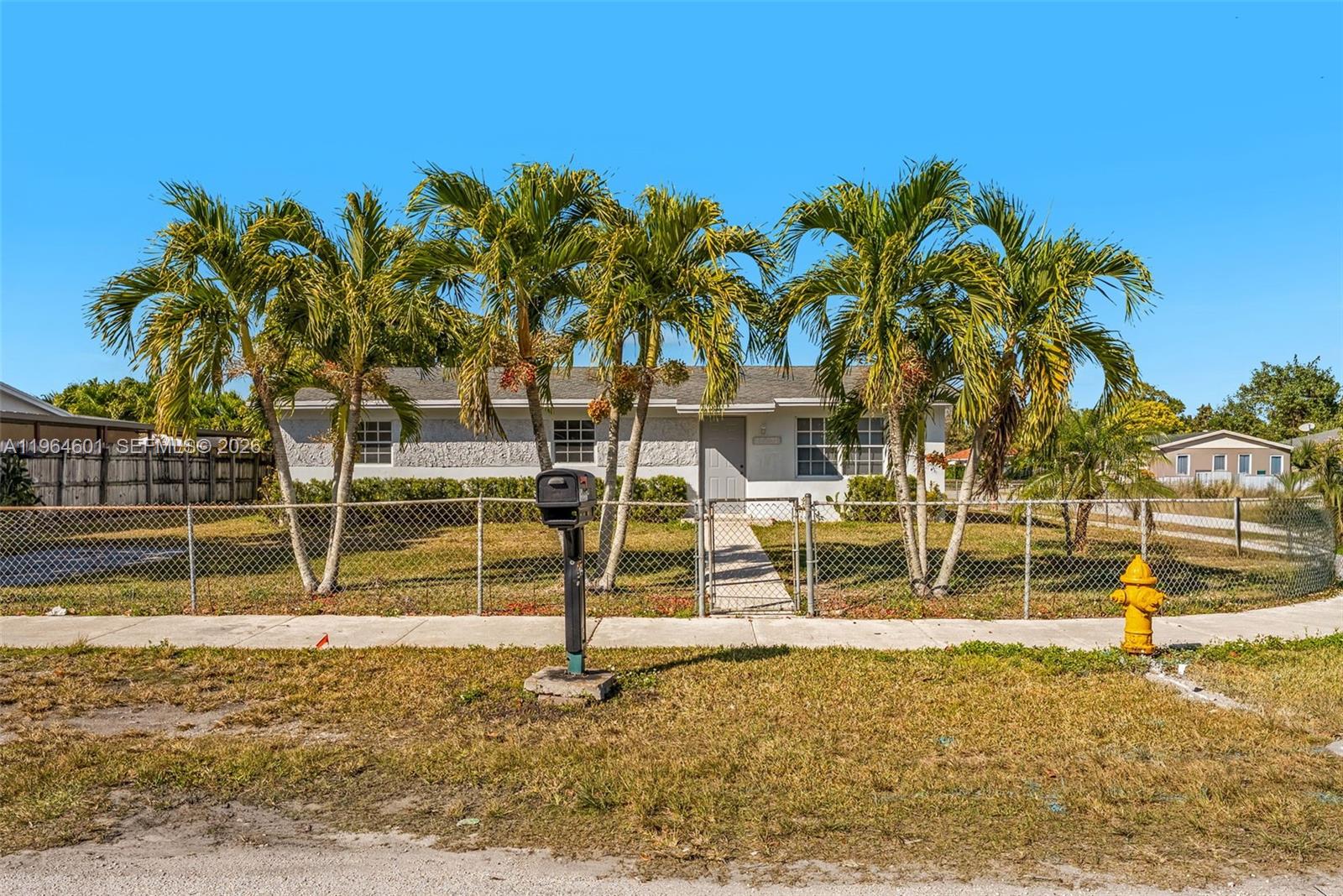15231 Southwest 302nd Street Homestead, FL 33033 - Photo 25 of 30 a view of a swimming pool with a lounge chair
