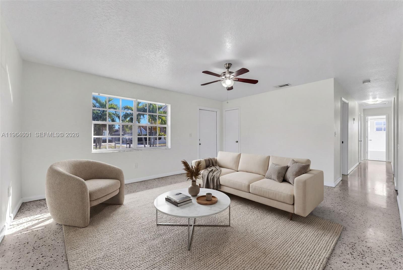 15231 Southwest 302nd Street Homestead, FL 33033 - Photo 6 of 30 a living room with furniture and a window