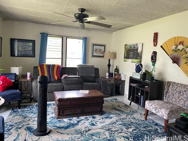 47-166 Wailehua Road Kaneohe, HI 96744 - Photo 4 of 17 a living room with furniture ceiling fan and a window