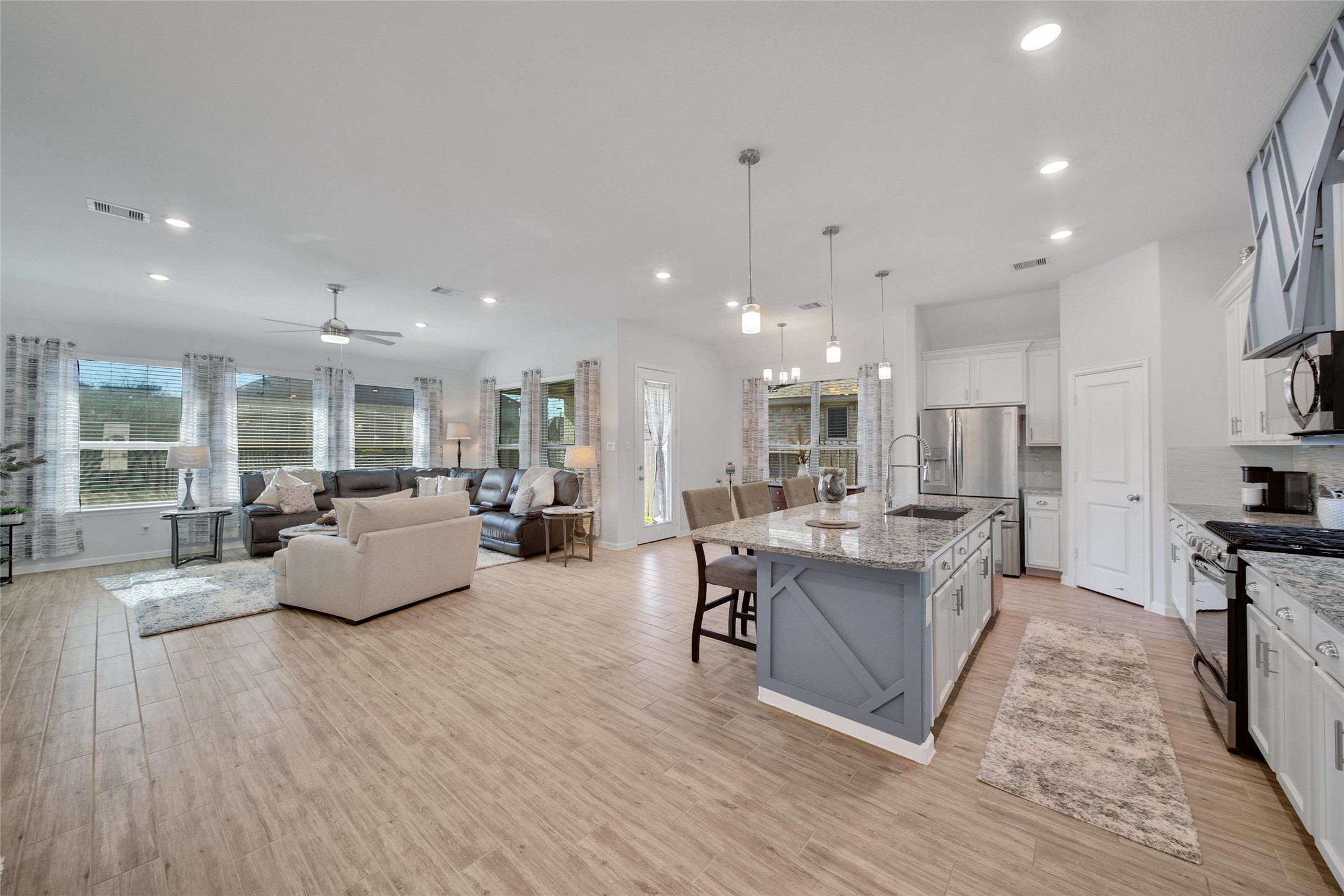 3422 Warwick River Trail Houston, TX 77365 - Photo 11 of 46 a living room with fireplace furniture and a wooden floor