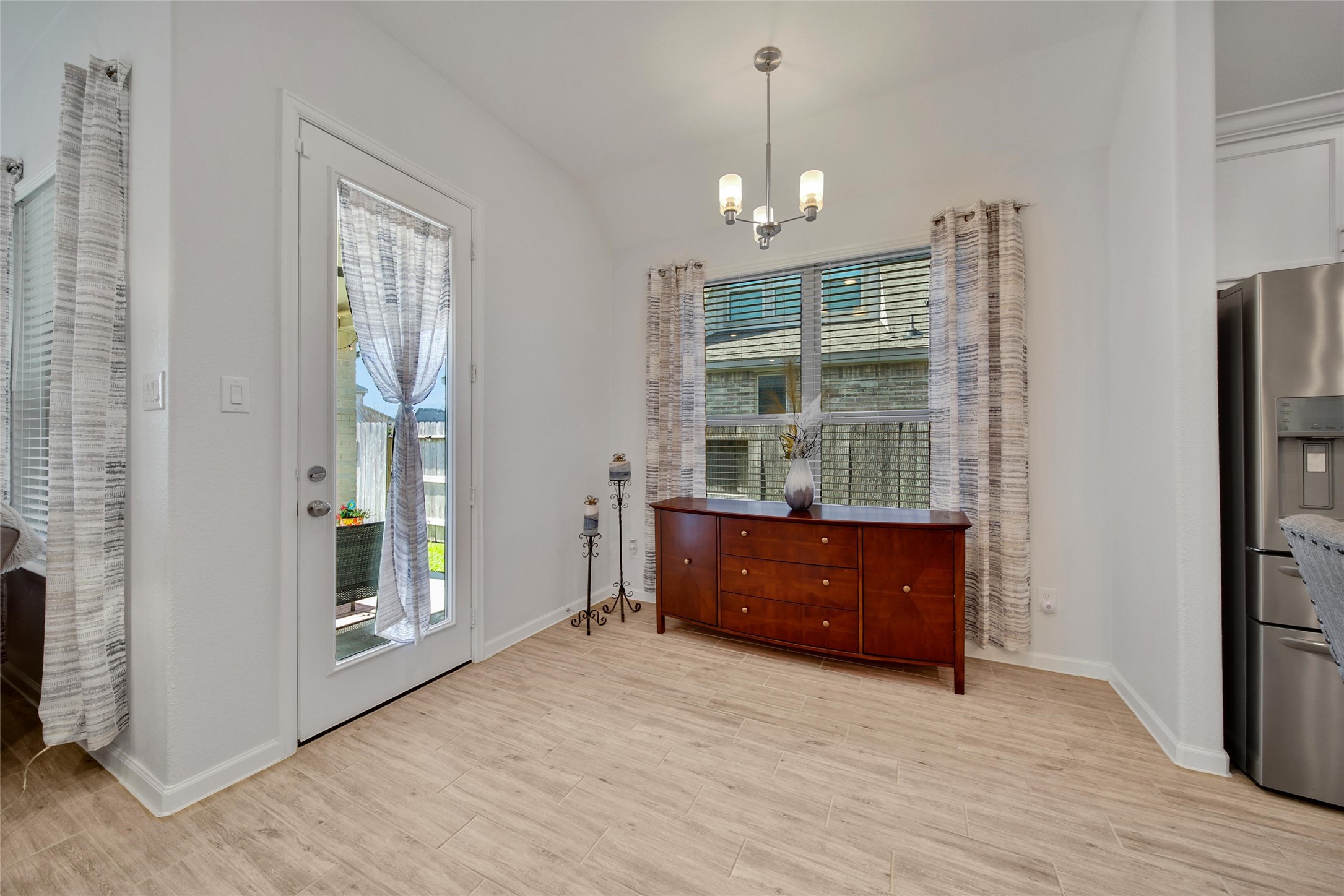 3422 Warwick River Trail Houston, TX 77365 - Photo 18 of 46 a room with window and wooden floor