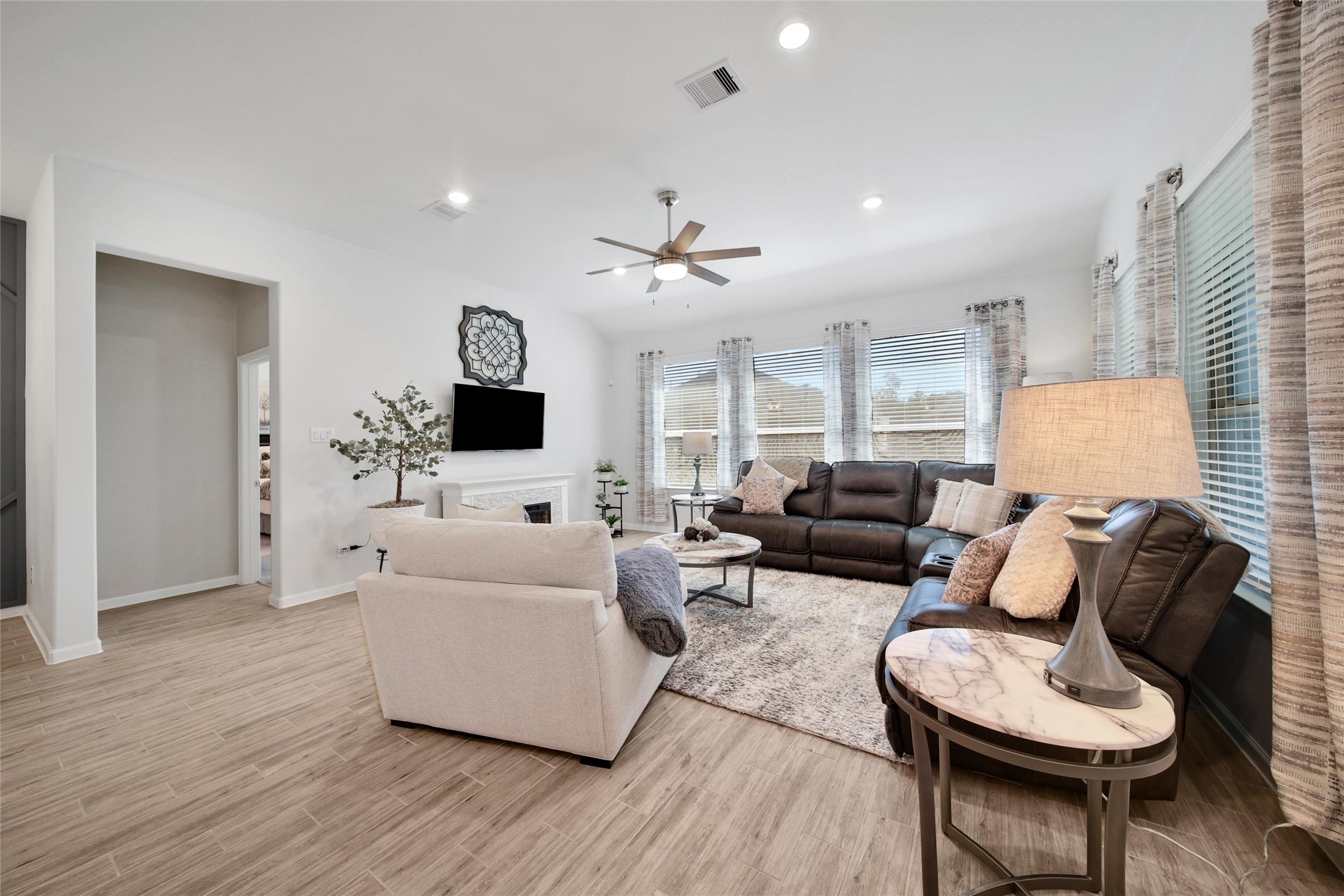 3422 Warwick River Trail Houston, TX 77365 - Photo 19 of 46 a living room with furniture and a flat screen tv