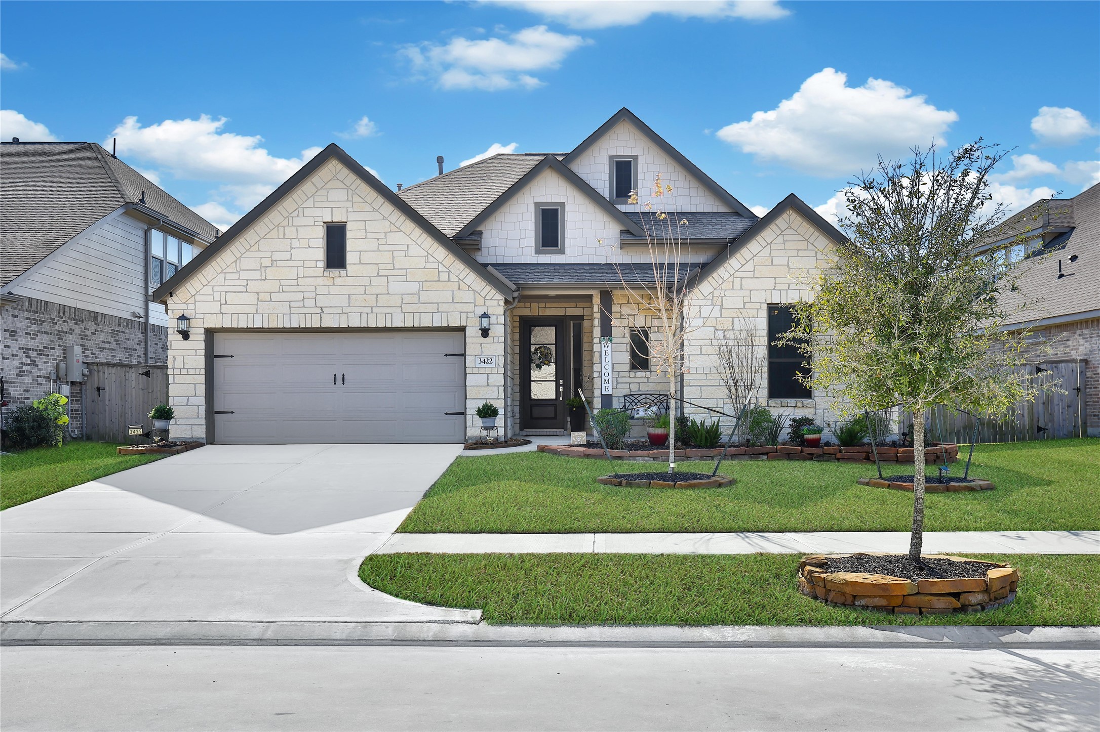 3422 Warwick River Trail Houston, TX 77365 - Photo 2 of 46 a front view of a house with a yard and garage