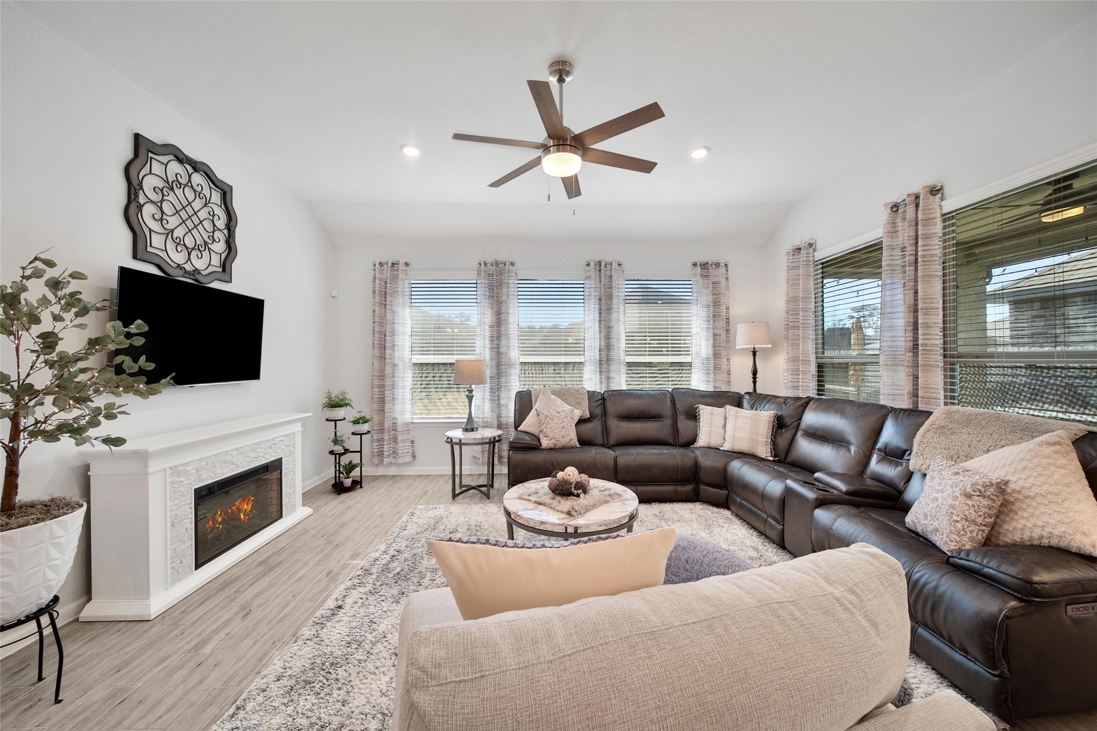 3422 Warwick River Trail Houston, TX 77365 - Photo 20 of 46 a living room with furniture fireplace and a flat screen tv
