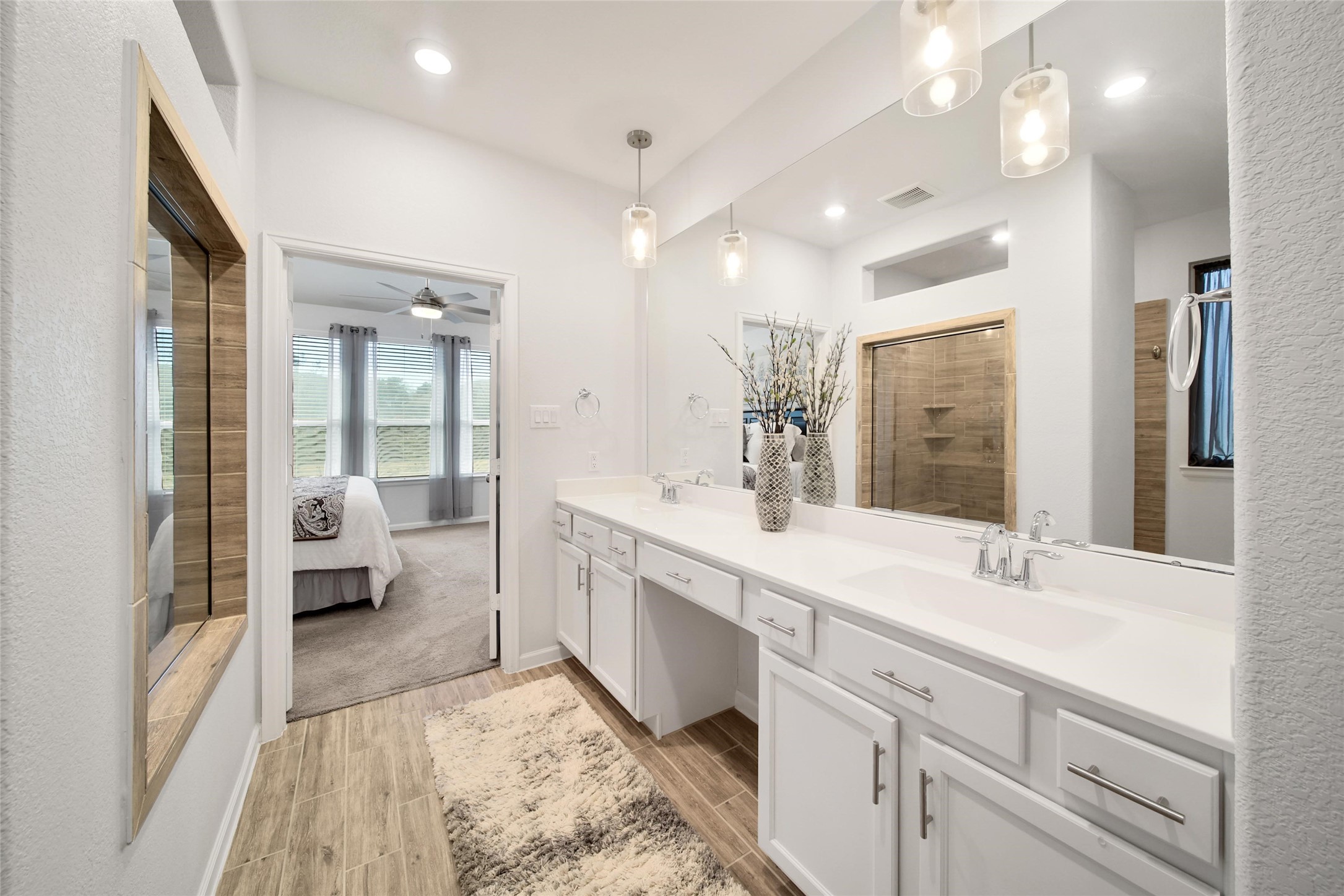3422 Warwick River Trail Houston, TX 77365 - Photo 27 of 46 a spacious bathroom with a double vanity sink and a mirror