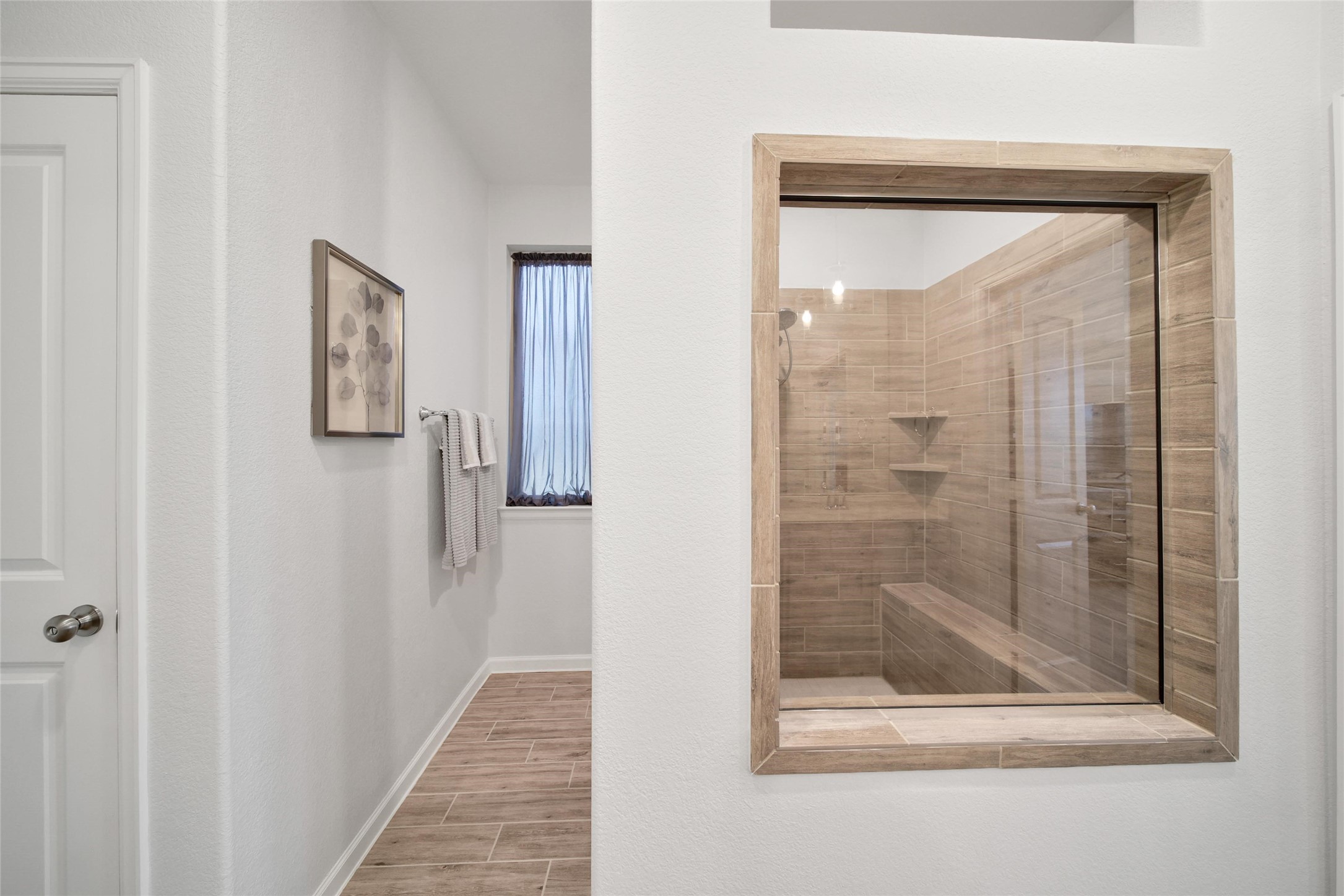3422 Warwick River Trail Houston, TX 77365 - Photo 28 of 46 a bathroom with a glass shower door