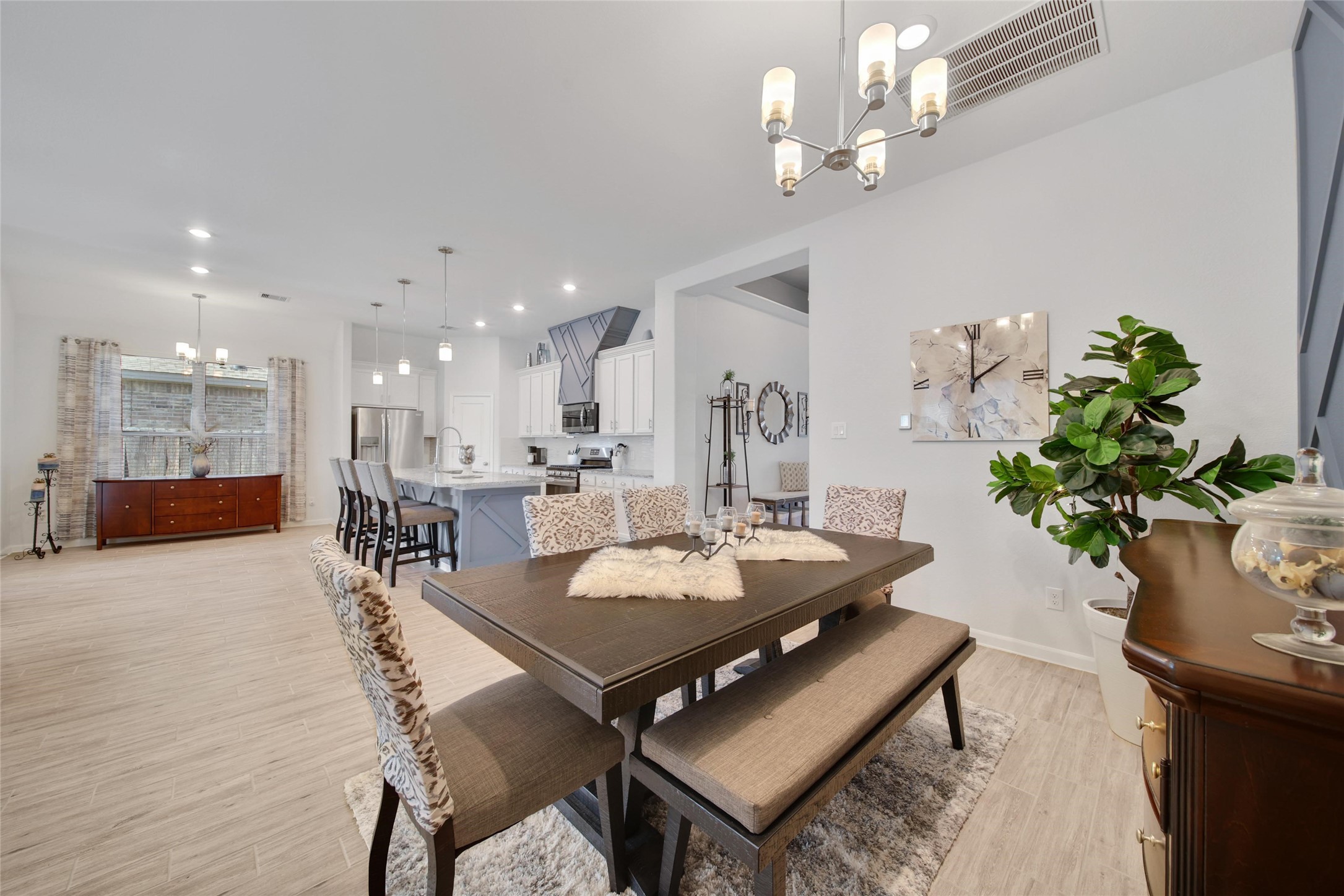 3422 Warwick River Trail Houston, TX 77365 - Photo 9 of 46 a view of a dining room with furniture and a chandelier