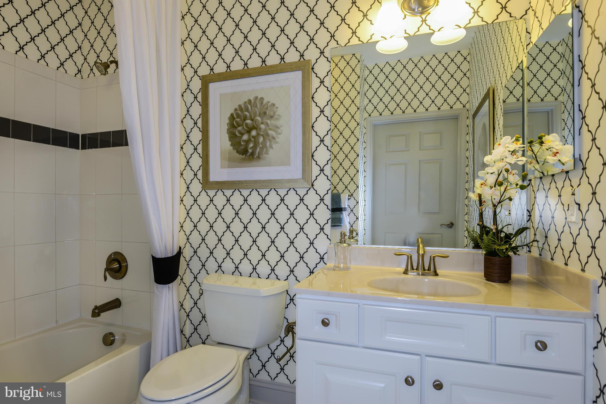 3750 Clara Downey Avenue, Unit 35 Silver Spring, MD 20906 - Photo 14 of 14 a bathroom with a sink a toilet and shower