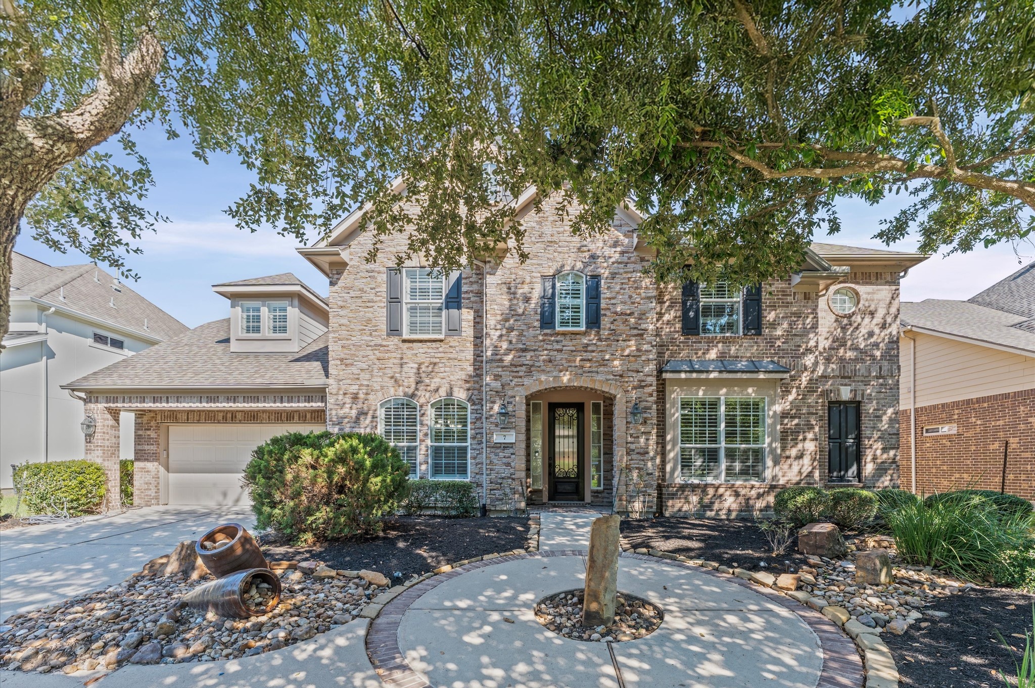 7 North Beech Springs Circle Spring, TX 77389 - Photo 2 of 50 a front view of a house with garden