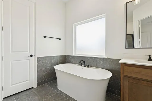 a bathroom with a double vanity sink and mirror