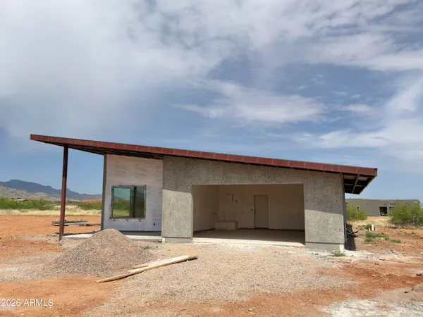 a front view of a house with a garage