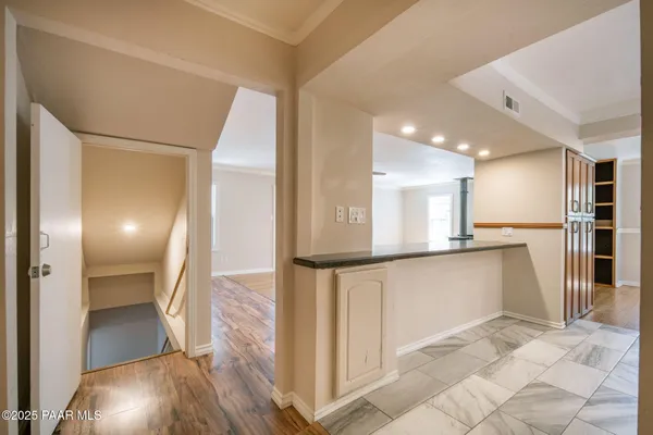 a bathroom with a double vanity sink a toilet and a shower