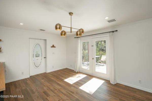 a view of kitchen with wooden floor