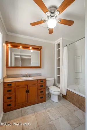a view of walk in closet with wooden floor