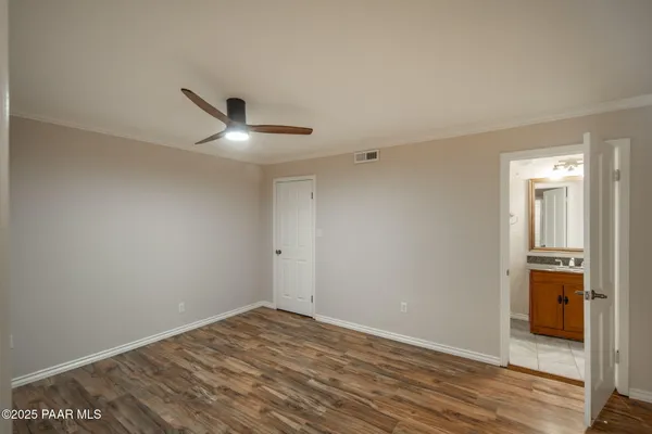 a view of a large house with a tree and a yard