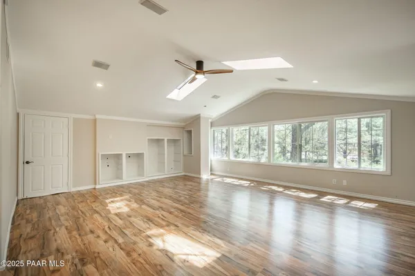 a large house with a large tree in front of it