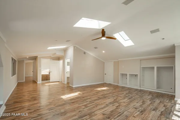 a view of a lush green hillside and houses