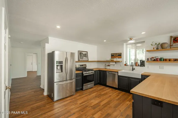 a spacious bathroom with a sink and mirror