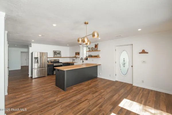 a bath tub sitting in a bathroom and shower